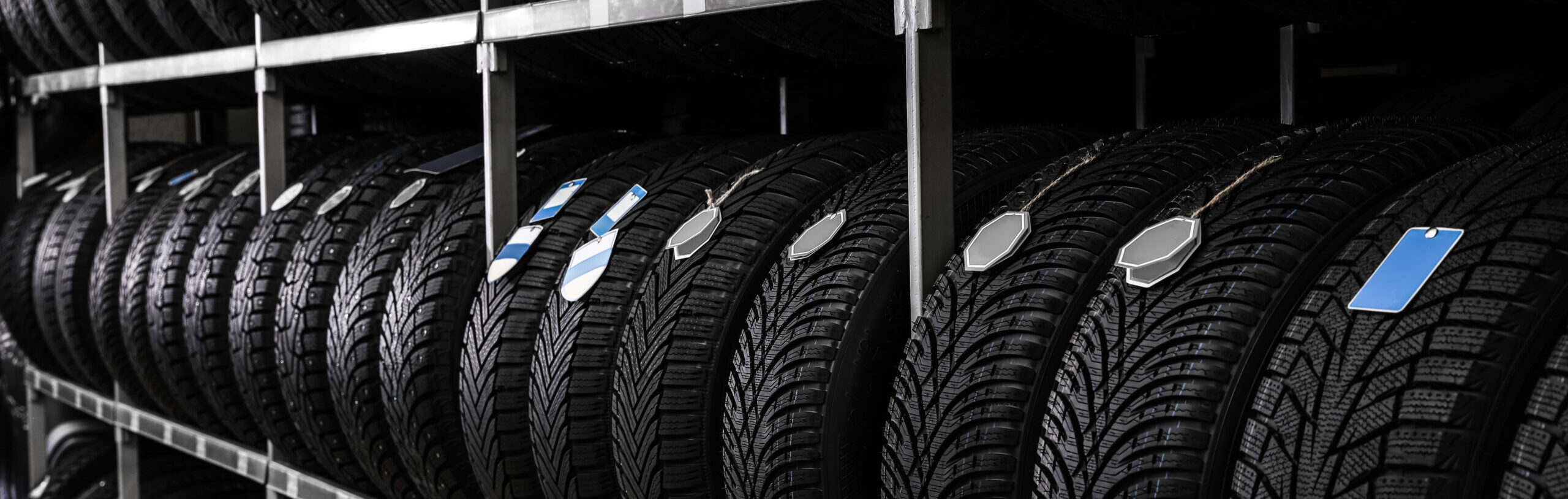 Car tires on rack in auto store